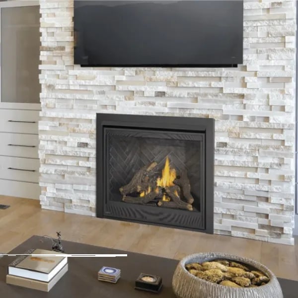 Modern gas fireplace insert with log set in stacked stone wall surround